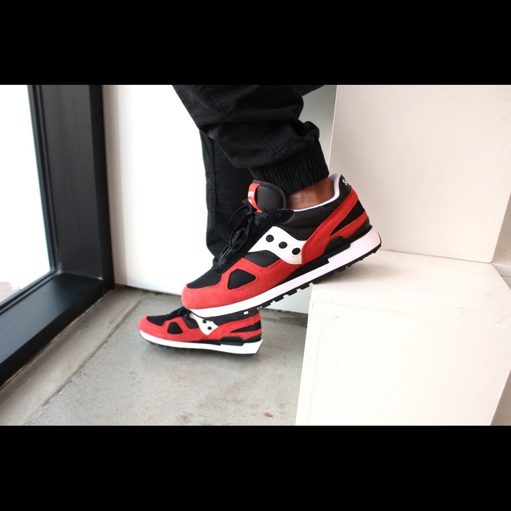 Red black and white saucony shoes
